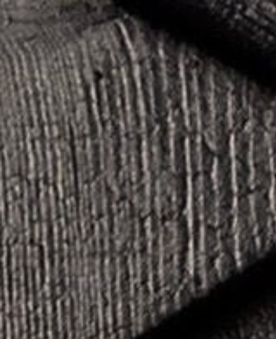 Close-up of a deeply charred surface
